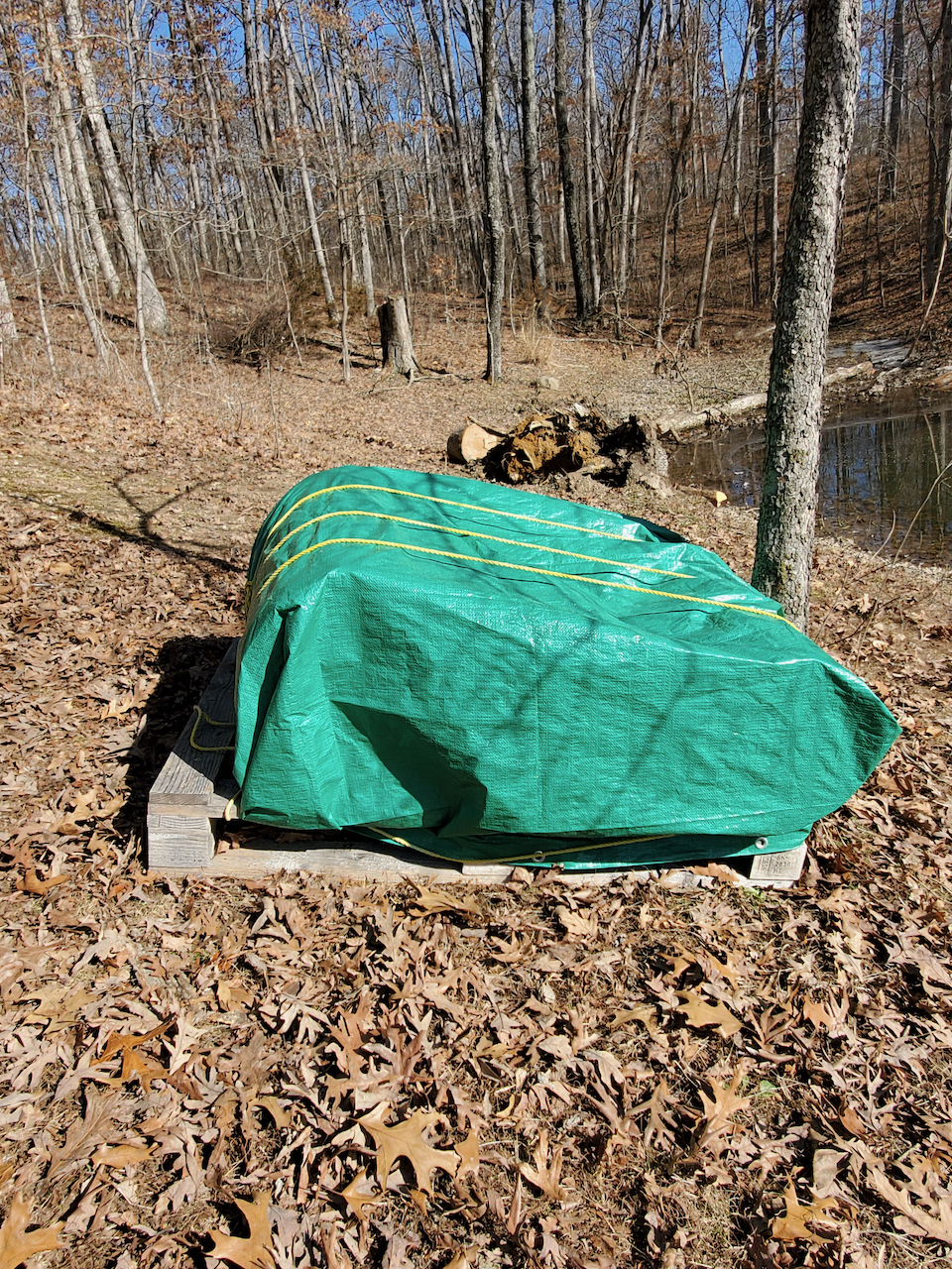 Remaining sections wrapped with a tarp